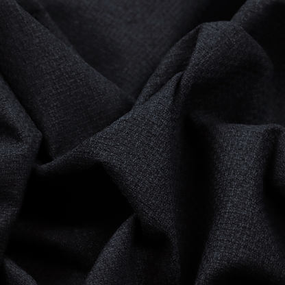 A fabric in midnight black. Dense, saturated weave of onyx and deep obsidian threads for a sleek matte finish.