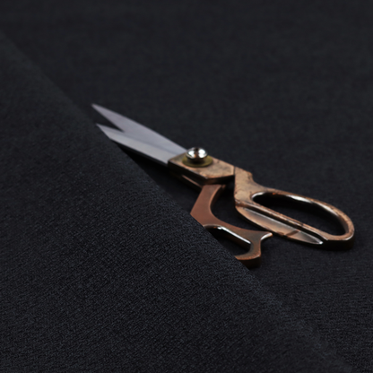 A fabric in midnight black. Dense, saturated weave of onyx and deep obsidian threads for a sleek matte finish.