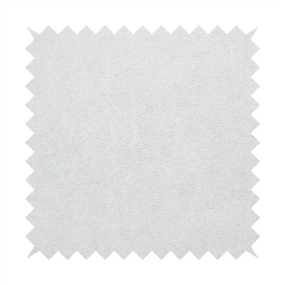 A creamy off-white fabric with a dense, velvety or short-pile texture. The surface is uniform and soft, featuring a fine, grainy appearance that suggests a plush material like micro-suede or high-end upholstery velvet.