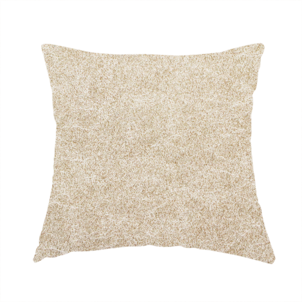 The fabric used to create this handmade cushion is a warm beige or tan fabric with a dense, felt-like or distressed texture. The material features a fine, mottled pattern where sandy brown fibres mix with ivory highlights. Subtle, irregular horizontal "veining" or crackle lines run across the surface, giving it an organic, lived-in look similar to soft suede or pressed wool.