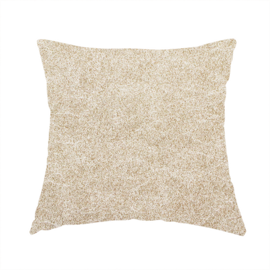 The fabric used to create this handmade cushion is a warm beige or tan fabric with a dense, felt-like or distressed texture. The material features a fine, mottled pattern where sandy brown fibres mix with ivory highlights. Subtle, irregular horizontal "veining" or crackle lines run across the surface, giving it an organic, lived-in look similar to soft suede or pressed wool.