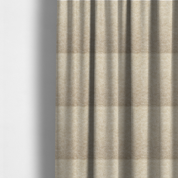 The fabric used to create these made-to-measure curtains is a warm beige or tan fabric with a dense, felt-like or distressed texture. The material features a fine, mottled pattern where sandy brown fibres mix with ivory highlights. Subtle, irregular horizontal "veining" or crackle lines run across the surface, giving it an organic, lived-in look similar to soft suede or pressed wool.