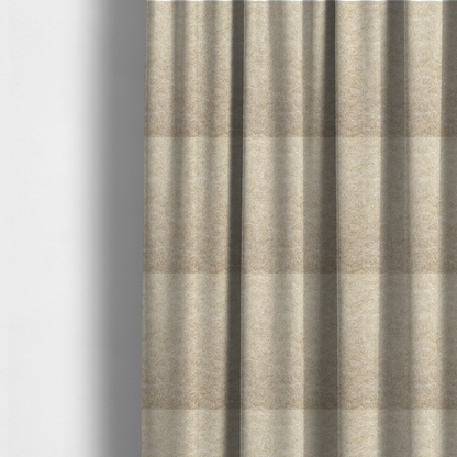 The fabric used to create these made-to-measure curtains is a warm beige or tan fabric with a dense, felt-like or distressed texture. The material features a fine, mottled pattern where sandy brown fibres mix with ivory highlights. Subtle, irregular horizontal "veining" or crackle lines run across the surface, giving it an organic, lived-in look similar to soft suede or pressed wool.