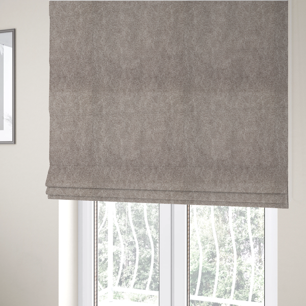 The fabric used to create these Roman blinds is a taupe or mushroom-coloured fabric with a rich, distressed texture. The material features a fine, pebble-like grain combined with thin, irregular light-coloured "crackle" lines that mimic the look of aged leather or pressed felt. The colour is a sophisticated blend of dusty brown and grey tones with ivory highlights.