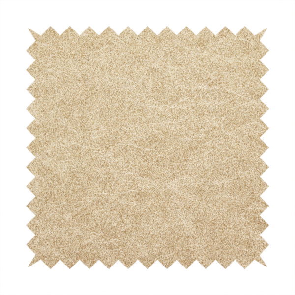 A golden-tan or sand-coloured fabric with a dense, weathered texture. The material has a soft, matte finish with a fine mottled pattern of light cream and warm brown fibres. Subtle, irregular horizontal "crackle" lines or faint creases run throughout the surface, giving it the weathered appearance of distressed suede or pressed wool.