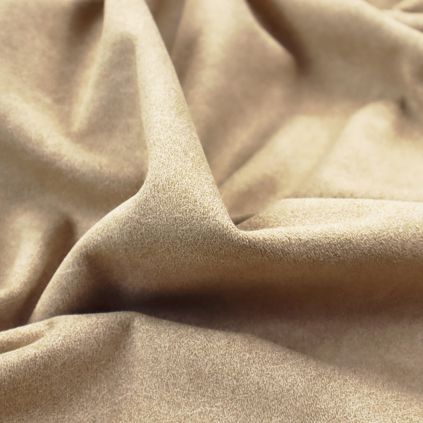 A golden-tan or sand-coloured fabric with a dense, weathered texture. The material has a soft, matte finish with a fine mottled pattern of light cream and warm brown fibres. Subtle, irregular horizontal "crackle" lines or faint creases run throughout the surface, giving it the weathered appearance of distressed suede or pressed wool.