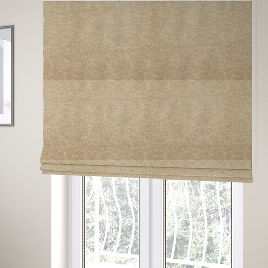 The fabric used to create these Roman blinds is a golden-tan or sand-coloured fabric with a dense, weathered texture. The material has a soft, matte finish with a fine mottled pattern of light cream and warm brown fibres. Subtle, irregular horizontal "crackle" lines or faint creases run throughout the surface, giving it the weathered appearance of distressed suede or pressed wool.