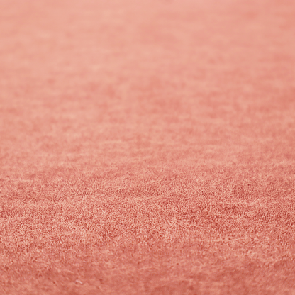 A terracotta or muted coral fabric with a rich, distressed texture. The material features a fine, stippled blend of reddish-clay tones and lighter peachy fibres. It is characterized by faint, irregular light-coloured "crackle" lines that give it the appearance of weathered suede, microfiber, or industrial felt.