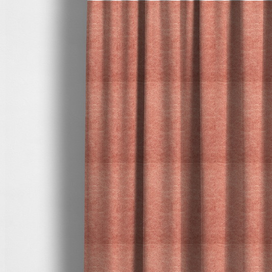 The fabric used to create these made-to-measure curtains is a terracotta or muted coral fabric with a rich, distressed texture. The material features a fine, stippled blend of reddish-clay tones and lighter peachy fibres. It is characterized by faint, irregular light-coloured "crackle" lines that give it the appearance of weathered suede, microfiber, or industrial felt.
