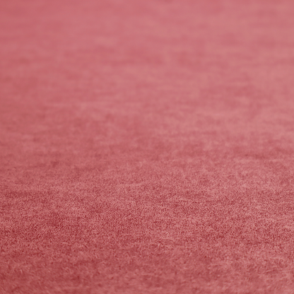 A deep rose or berry-red fabric with a rich, distressed felt-like texture. The surface features a fine, stippled pattern of muted red and soft pink fibres, creating a weathered effect. Delicate, irregular light-coloured "crackle" lines run throughout, giving it an organic, weathered look similar to suede or industrial-grade wool.
