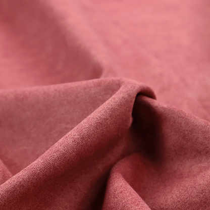 A deep rose or berry-red fabric with a rich, distressed felt-like texture. The surface features a fine, stippled pattern of muted red and soft pink fibres, creating a weathered effect. Delicate, irregular light-coloured "crackle" lines run throughout, giving it an organic, weathered look similar to suede or industrial-grade wool.