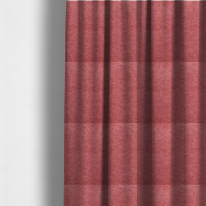 The fabric used to create these made-to-measure curtains is a deep rose or berry-red fabric with a rich, distressed felt-like texture. The surface features a fine, stippled pattern of muted red and soft pink fibres, creating a weathered effect. Delicate, irregular light-coloured "crackle" lines run throughout, giving it an organic, weathered look similar to suede or industrial-grade wool.