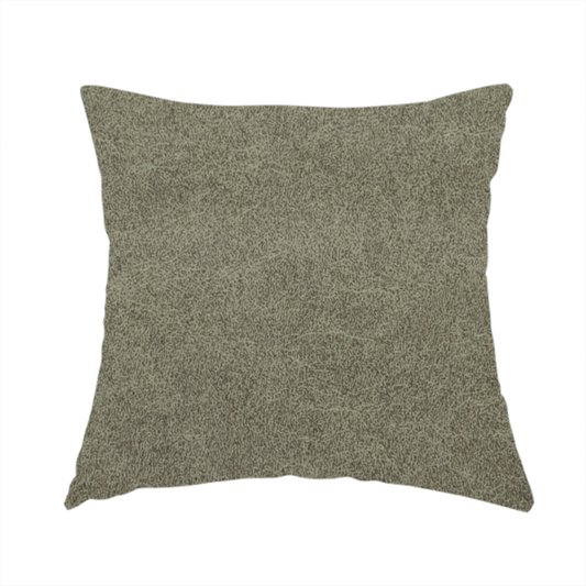The fabric used to create these handmade cushions is a olive-drab or sage-green fabric with a rich, distressed texture. The material features a dense, mottled pattern where dark earthy green fibres are interspersed with lighter, pale-green highlights. Like others in this series, it is characterized by faint, irregular light-coloured "crackle" lines that give it the appearance of weathered suede or industrial felt.