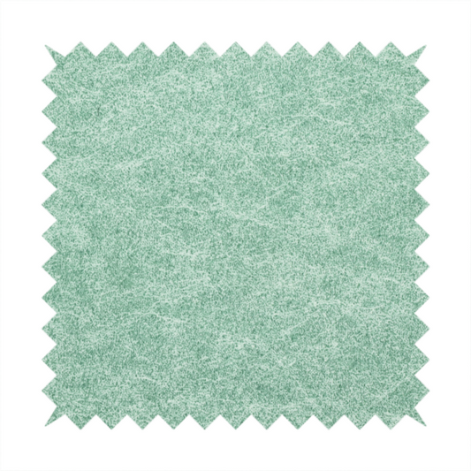 A seafoam or sage green fabric with a rich, distressed felt-like texture. The material features a vibrant yet soft mottled pattern of mint green and pale cream fibres. It is characterized by the signature irregular, light-coloured "crackle" lines found in this collection, giving it the weathered appearance of premium suede or industrial wool.