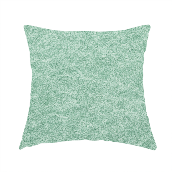 The fabric used to create this handmade cushion is a seafoam or sage green fabric with a rich, distressed felt-like texture. The material features a vibrant yet soft mottled pattern of mint green and pale cream fibres. It is characterized by the signature irregular, light-coloured "crackle" lines found in this collection, giving it the weathered appearance of premium suede or industrial wool.