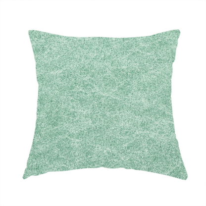 The fabric used to create this handmade cushion is a seafoam or sage green fabric with a rich, distressed felt-like texture. The material features a vibrant yet soft mottled pattern of mint green and pale cream fibres. It is characterized by the signature irregular, light-coloured "crackle" lines found in this collection, giving it the weathered appearance of premium suede or industrial wool.
