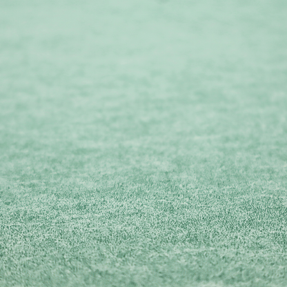 A seafoam or sage green fabric with a rich, distressed felt-like texture. The material features a vibrant yet soft mottled pattern of mint green and pale cream fibres. It is characterized by the signature irregular, light-coloured "crackle" lines found in this collection, giving it the weathered appearance of premium suede or industrial wool.
