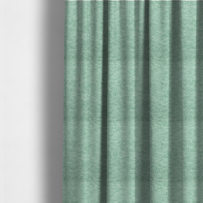 The fabric used to create these made-to-measure curtains is a seafoam or sage green fabric with a rich, distressed felt-like texture. The material features a vibrant yet soft mottled pattern of mint green and pale cream fibres. It is characterized by the signature irregular, light-coloured "crackle" lines found in this collection, giving it the weathered appearance of premium suede or industrial wool.