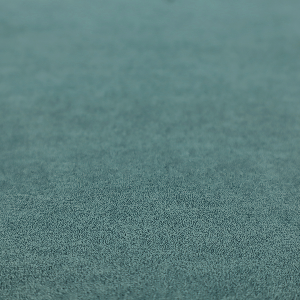 A teal or dark seafoam green fabric with a dense, distressed felt-like texture. The surface features an intricate mottled pattern of deep blue-green fibres mixed with lighter cyan highlights. It contains the signature irregular, light-coloured "crackle" veins seen throughout this collection, giving it the weathered appearance of premium distressed suede or heavy-duty wool.