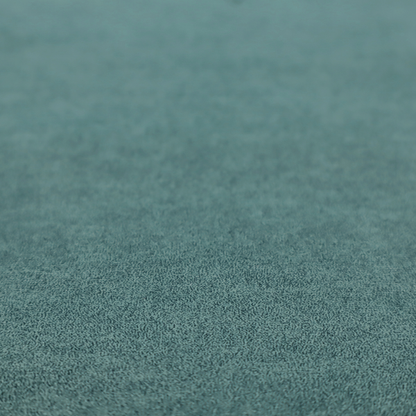 A teal or dark seafoam green fabric with a dense, distressed felt-like texture. The surface features an intricate mottled pattern of deep blue-green fibres mixed with lighter cyan highlights. It contains the signature irregular, light-coloured "crackle" veins seen throughout this collection, giving it the weathered appearance of premium distressed suede or heavy-duty wool.