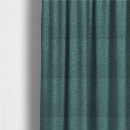 The fabric used to create these made-to-measure curtains is a teal or dark seafoam green fabric with a dense, distressed felt-like texture. The surface features an intricate mottled pattern of deep blue-green fibres mixed with lighter cyan highlights. It contains the signature irregular, light-coloured "crackle" veins seen throughout this collection, giving it the weathered appearance of premium distressed suede or heavy-duty wool.