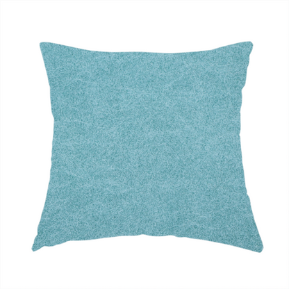 The fabric used to create this handmade cushion is a bright aqua or turquoise fabric with a dense, distressed felt-like texture. The surface features a vibrant mottled pattern of cyan and pale blue fibres, creating a weathered effect. It is characterized by irregular, light-coloured "crackle" lines that give it the weathered appearance of premium suede or industrial wool.