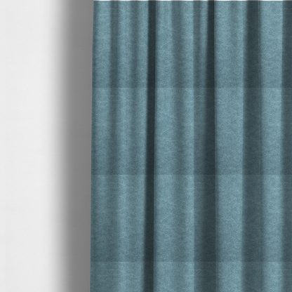 The fabric used to create these made-to-measure curtains is a dusty blue or slate blue fabric with a dense, distressed felt-like texture. The material features a sophisticated mottled pattern of medium blue and muted grey fibres. It contains the signature irregular, light-coloured "crackle" veins characteristic of this collection, giving it the weathered appearance of premium distressed suede or industrial wool.