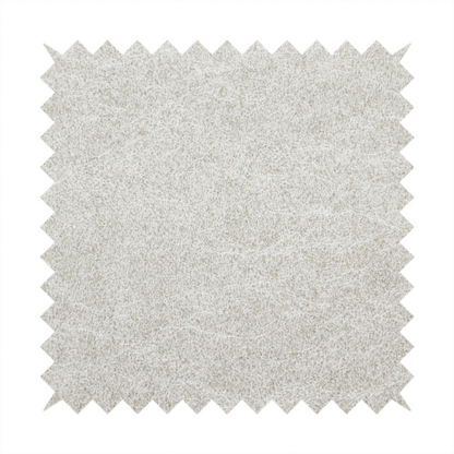A pale greige or parchment-coloured fabric with a dense, distressed felt-like texture. The surface features a subtle mottled pattern of light cream and soft grey fibres, creating a clean, weathered look. Like the others in this collection, it includes irregular, light-coloured "crackle" lines that give it the weathered appearance of distressed suede or pressed wool.