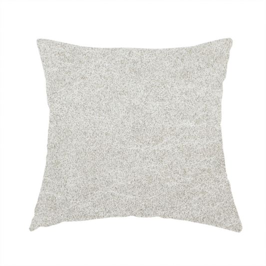 The fabric used to create these handmade cushions is a pale greige or parchment-coloured fabric with a dense, distressed felt-like texture. The surface features a subtle mottled pattern of light cream and soft grey fibres, creating a clean, weathered look. Like the others in this collection, it includes irregular, light-coloured "crackle" lines that give it the weathered appearance of distressed suede or pressed wool.