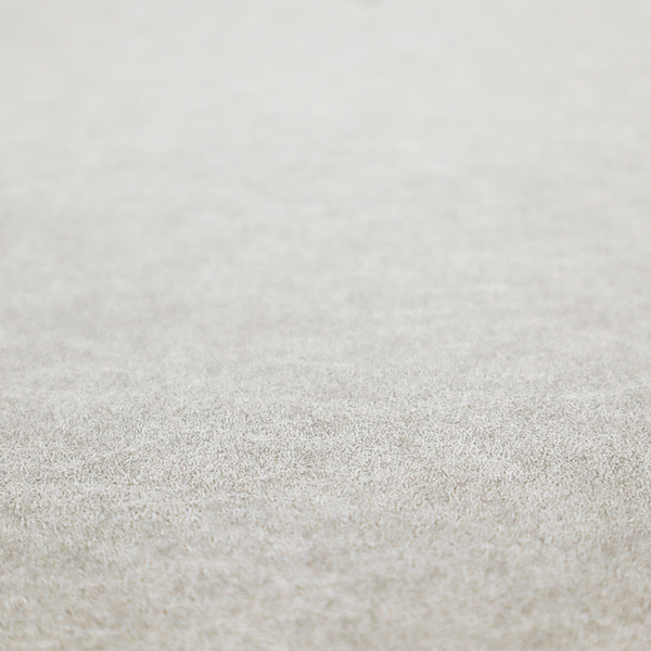 A pale greige or parchment-coloured fabric with a dense, distressed felt-like texture. The surface features a subtle mottled pattern of light cream and soft grey fibres, creating a clean, weathered look. Like the others in this collection, it includes irregular, light-coloured "crackle" lines that give it the weathered appearance of distressed suede or pressed wool.