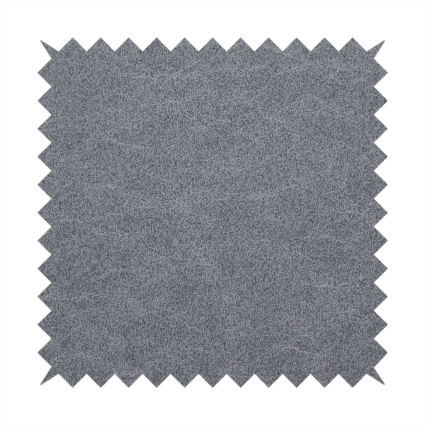 A charcoal or slate grey fabric with a rich, distressed felt-like texture. The surface features an intricate, stippled pattern of deep grey fibres mixed with lighter silver highlights. It is characterized by organic, vein-like distressing and light-coloured crackle lines, mimicking the look of weathered leather or heavy-duty industrial felt.