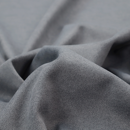 A charcoal or slate grey fabric with a rich, distressed felt-like texture. The surface features an intricate, stippled pattern of deep grey fibres mixed with lighter silver highlights. It is characterized by organic, vein-like distressing and light-coloured crackle lines, mimicking the look of weathered leather or heavy-duty industrial felt.
