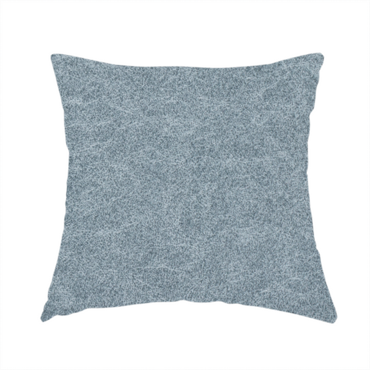 The fabric used to create this handmade cushion is a steel blue or denim grey fabric with a dense, distressed felt-like texture. The material features a sophisticated mottled blend of medium blue and grey fibres, creating a cool-toned weathered effect. It includes the collection’s signature irregular, light-coloured "crackle" lines that give it the weathered appearance of premium distressed suede or industrial wool.