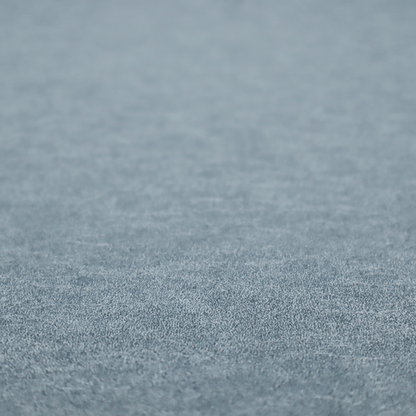 A steel blue or denim grey fabric with a dense, distressed felt-like texture. The material features a sophisticated mottled blend of medium blue and grey fibres, creating a cool-toned weathered effect. It includes the collection’s signature irregular, light-coloured "crackle" lines that give it the weathered appearance of premium distressed suede or industrial wool.