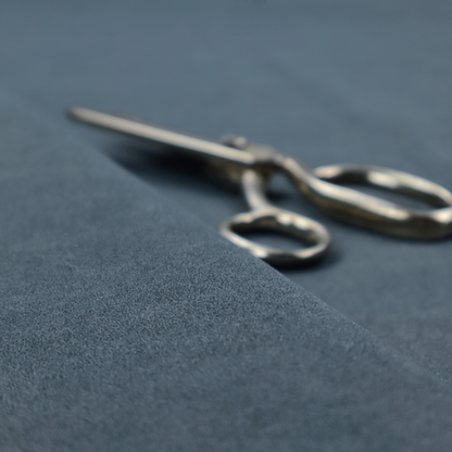 A dark navy or midnight blue fabric with a dense, distressed felt-like texture. This material is the darkest blue in the collection, featuring a tight, mottled blend of deep indigo and slate grey fibres. It is characterized by the signature organic, light-coloured "crackle" veins that give it the weathered appearance of premium distressed suede or heavy-duty industrial wool.