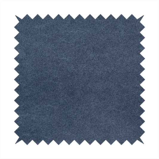 A dark slate or indigo blue fabric with a dense, distressed felt-like texture. As the deepest blue in this collection, the surface features a rich mottled blend of midnight blue and dark grey fibres. It is characterized by organic, light-coloured "crackle" lines that provide a weathered, vintage look similar to distressed leather or premium industrial wool.