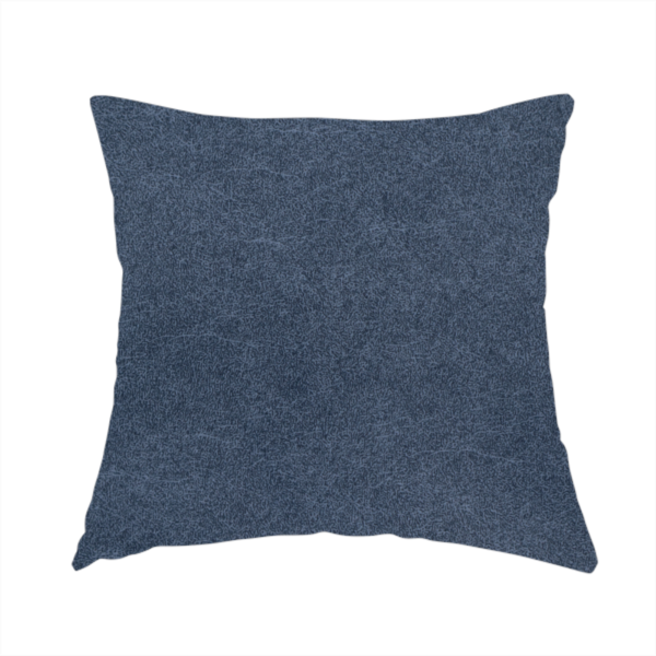 The fabric used to create this handmade cushion is a dark slate or indigo blue fabric with a dense, distressed felt-like texture. As the deepest blue in this collection, the surface features a rich mottled blend of midnight blue and dark grey fibres. It is characterized by organic, light-coloured "crackle" lines that provide a weathered, vintage look similar to distressed leather or premium industrial wool.