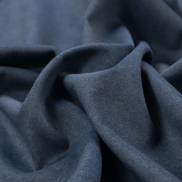 A dark slate or indigo blue fabric with a dense, distressed felt-like texture. As the deepest blue in this collection, the surface features a rich mottled blend of midnight blue and dark grey fibres. It is characterized by organic, light-coloured "crackle" lines that provide a weathered, vintage look similar to distressed leather or premium industrial wool.