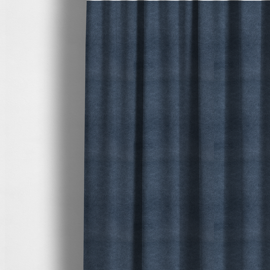 The fabric used to create these made-to-measure curtains is a dark slate or indigo blue fabric with a dense, distressed felt-like texture. As the deepest blue in this collection, the surface features a rich mottled blend of midnight blue and dark grey fibres. It is characterized by organic, light-coloured "crackle" lines that provide a weathered, vintage look similar to distressed leather or premium industrial wool.