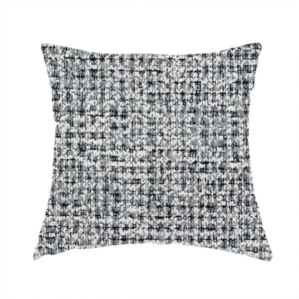 The fabric used to create this handmade cushion is a dense, multi-tonal grey woven fabric. The textile features a salt-and-pepper blend of charcoal, silver-grey, and off-white yarns in a tactile, nubby bouclé weave.