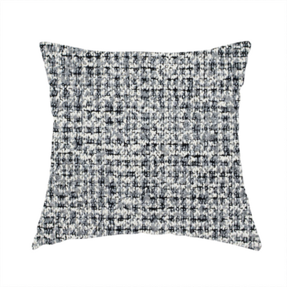 The fabric used to create this handmade cushion is a dense, multi-tonal grey woven fabric. The textile features a salt-and-pepper blend of charcoal, silver-grey, and off-white yarns in a tactile, nubby bouclé weave.