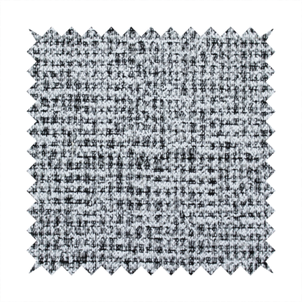 A textured woven upholstery fabric in a cool-toned grey and white salt-and-pepper pattern. The bouclé-style weave features horizontal rhythmic variations of charcoal and light grey yarns.