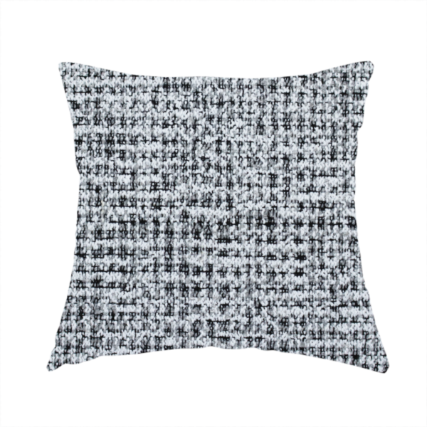 The fabric used to create this handmade cushion is a textured woven upholstery fabric in a cool-toned grey and white salt-and-pepper pattern. The bouclé-style weave features horizontal rhythmic variations of charcoal and light grey yarns.