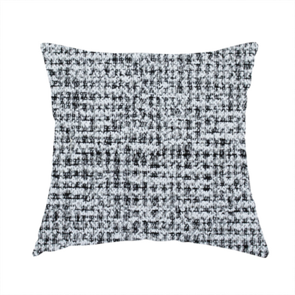 The fabric used to create this handmade cushion is a textured woven upholstery fabric in a cool-toned grey and white salt-and-pepper pattern. The bouclé-style weave features horizontal rhythmic variations of charcoal and light grey yarns.