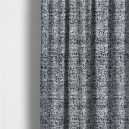 The fabric used to create these made to-measure curtains is a textured woven upholstery fabric in a cool-toned grey and white salt-and-pepper pattern. The bouclé-style weave features horizontal rhythmic variations of charcoal and light grey yarns.