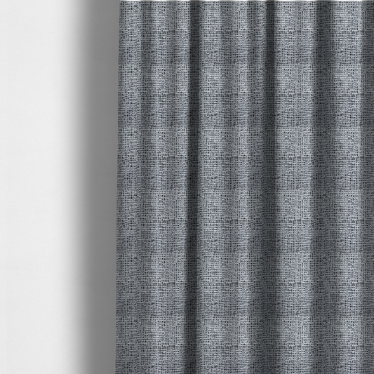 The fabric used to create these made to-measure curtains is a textured woven upholstery fabric in a cool-toned grey and white salt-and-pepper pattern. The bouclé-style weave features horizontal rhythmic variations of charcoal and light grey yarns.