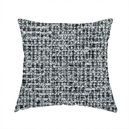 The fabric used to create this handmade cushion is a dense, textured woven fabric in a charcoal and ash-grey salt-and-pepper pattern. The weave features tightly packed, nubby bouclé yarns with a subtle vertical and horizontal grid-like structure.