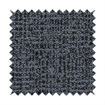 A dark, heavyweight woven fabric with a deep slate and charcoal marl pattern. The dense bouclé weave creates a low-contrast, pebbled texture with a uniform, dark grey appearance.