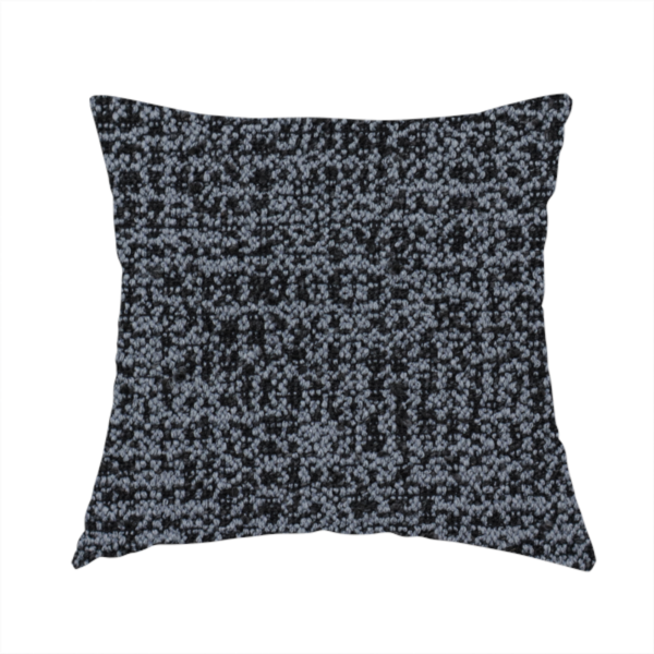 The fabric used to create this handmade cushion is a dark, heavyweight woven fabric with a deep slate and charcoal marl pattern. The dense bouclé weave creates a low-contrast, pebbled texture with a uniform, dark grey appearance.