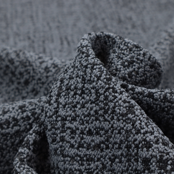 A dark, heavyweight woven fabric with a deep slate and charcoal marl pattern. The dense bouclé weave creates a low-contrast, pebbled texture with a uniform, dark grey appearance.